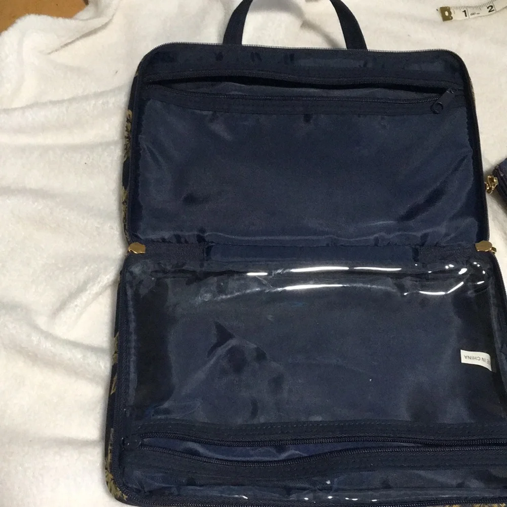 Celebrity travel bag and matching makeup bag. Navy blue with gold flowers